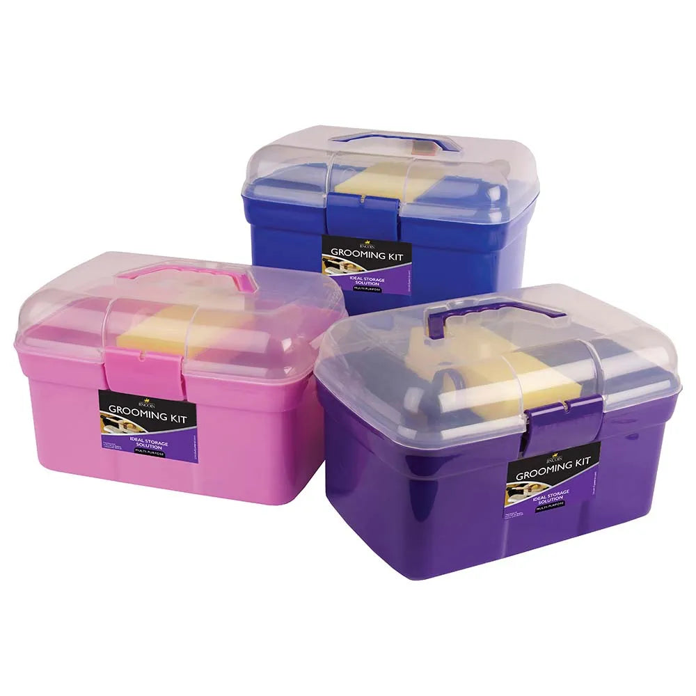 Three grooming kits in purple, pink, and blue with clear lids on a white background.